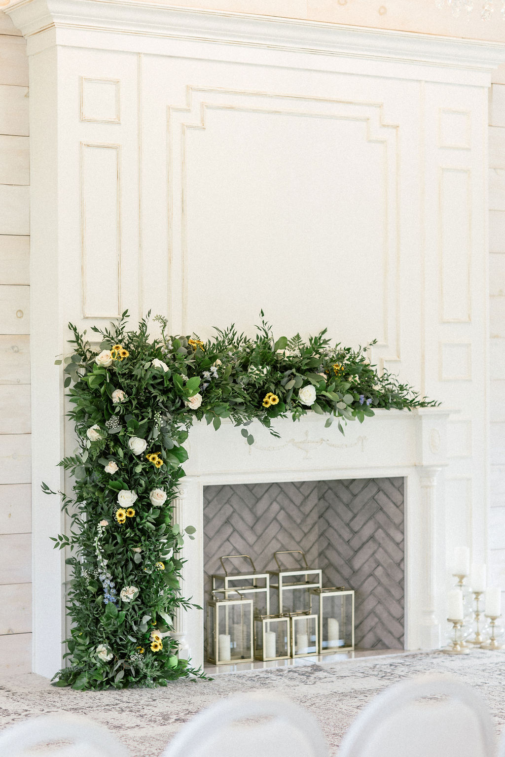 Floral Reef Designs Ottawa Wedding Florist - Amy Pinder Photography - Stonefields Estate wedding - Close up on greenery with soft florals at barn fireplace altar