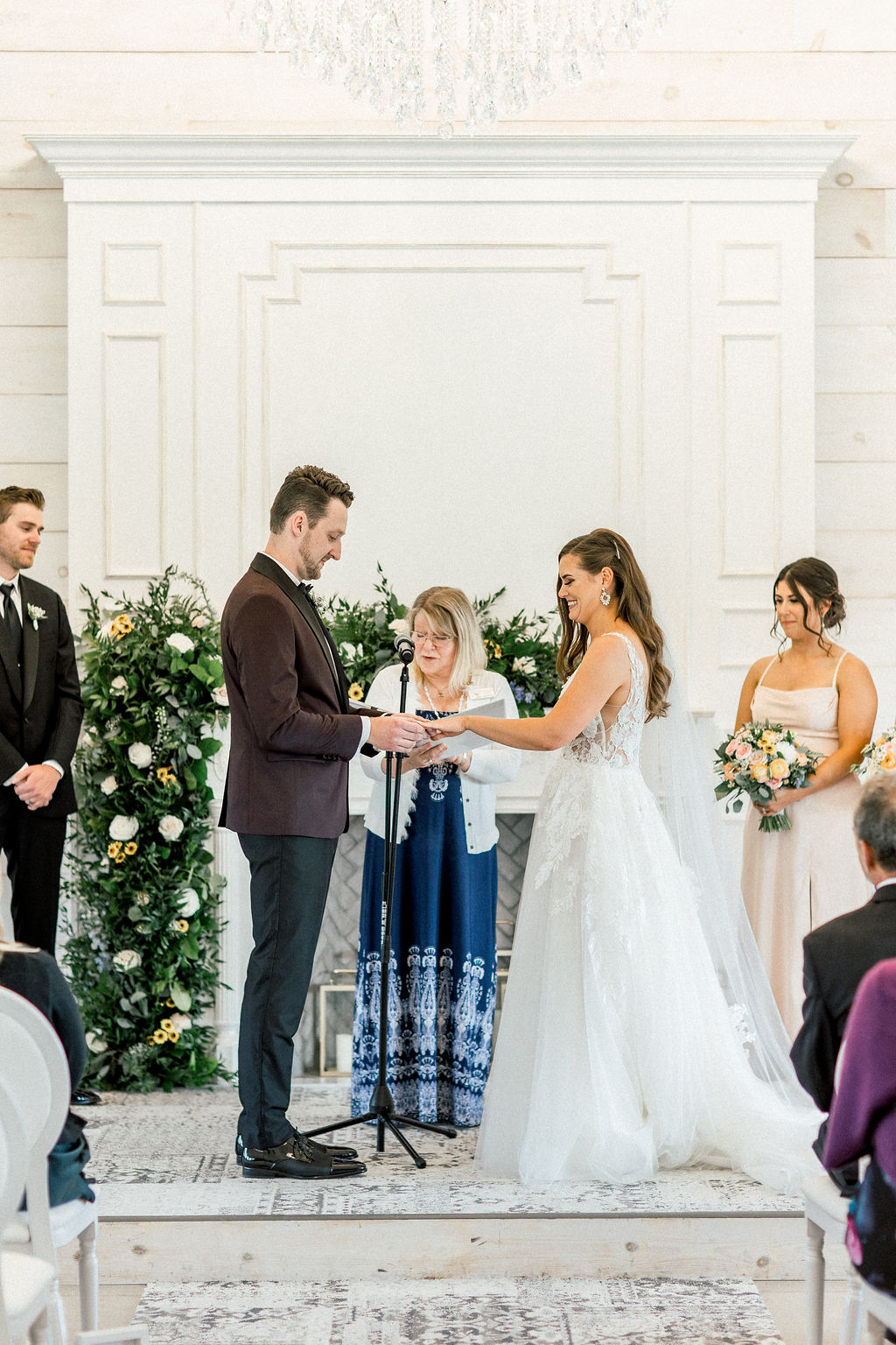 Floral Reef Designs Ottawa Wedding Florist - Amy Pinder Photography - Stonefields Estate wedding - Christie and Trevor getting married in front of fireplace greenery and floral installation